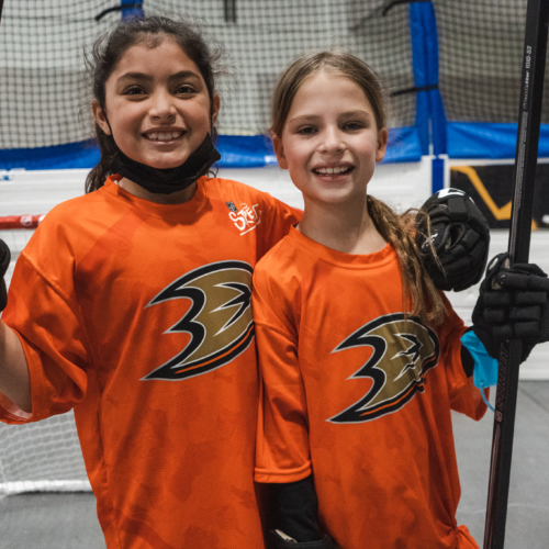 NHL STREET youth athletes with hockey sticks